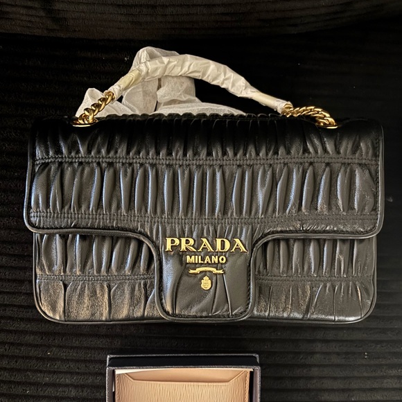 Prada Handbags - Prada Black Quilted Leather Bag with Gold Accents